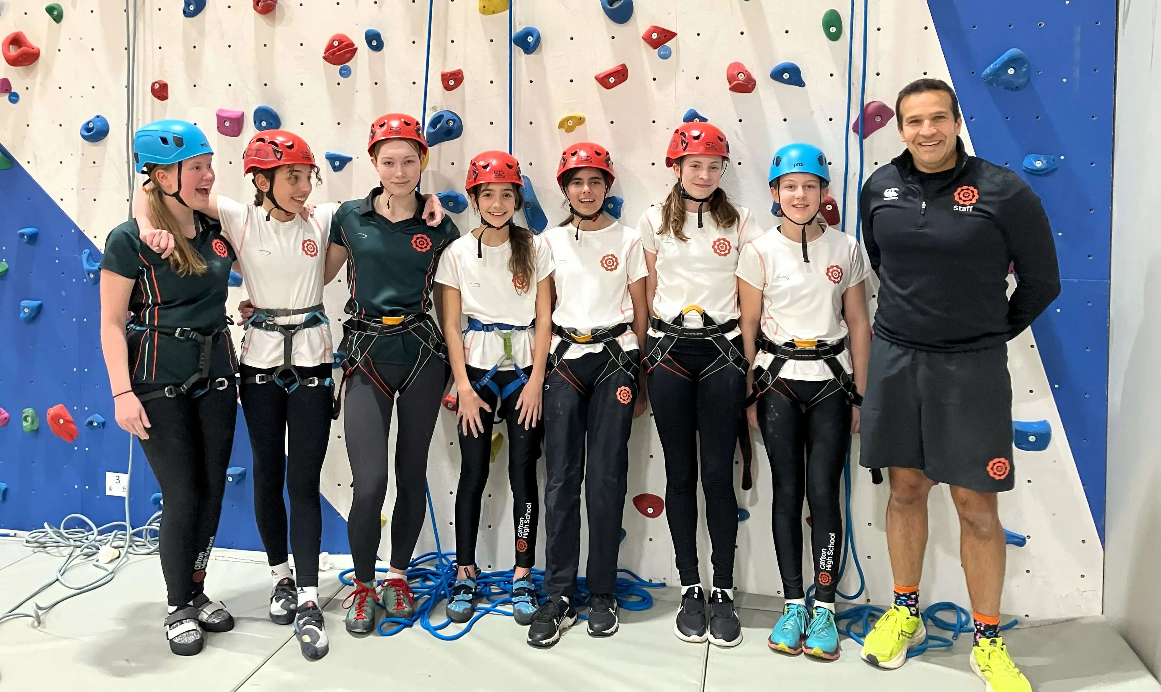 Pupils and teacher from Clifton High School, a co-educational private school in Bristol, at a climbing wall