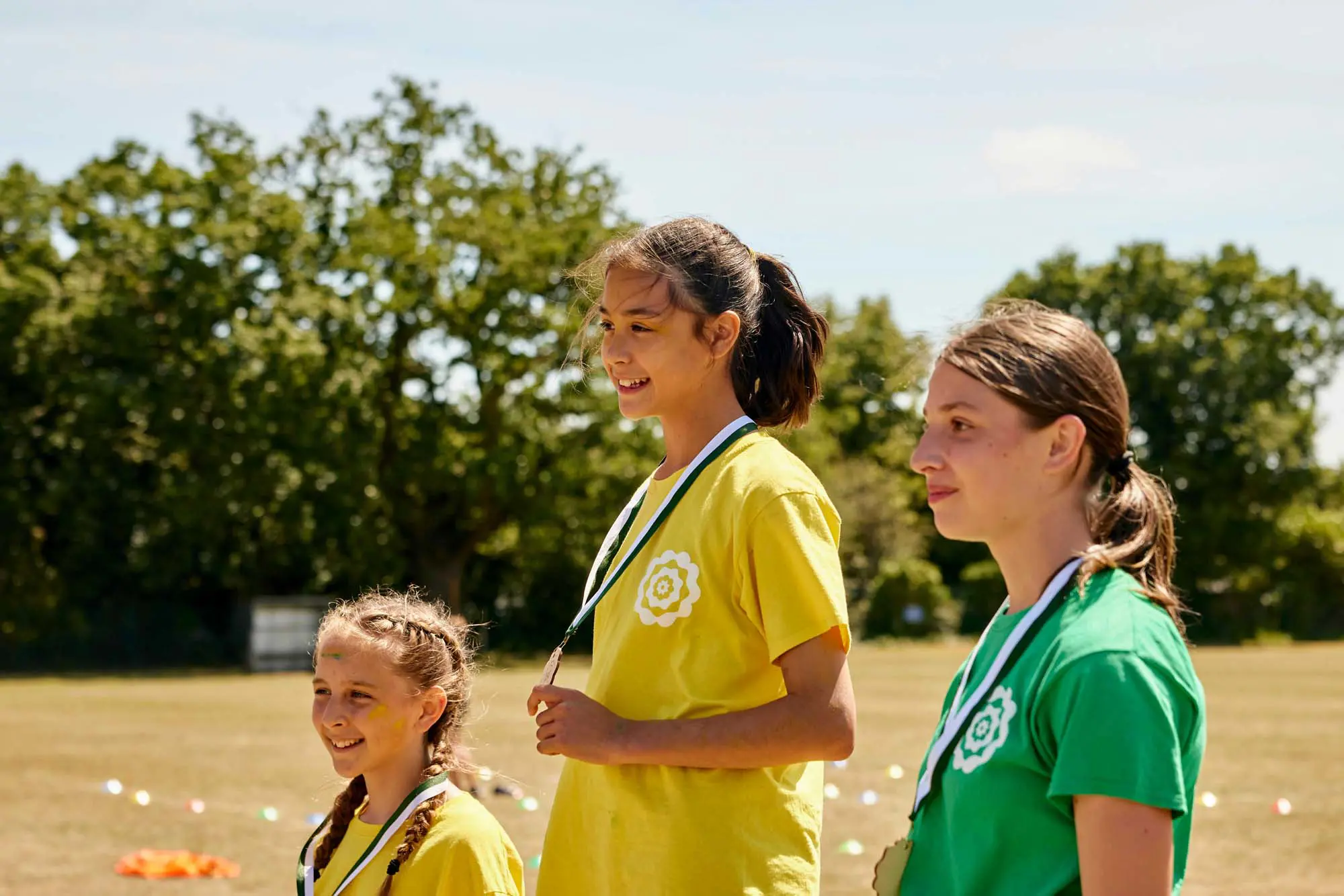 Senior School girls being awarded medals at Clifton High School's annual Sports Day held at Coombe Dingle